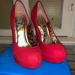 Red suede pumps